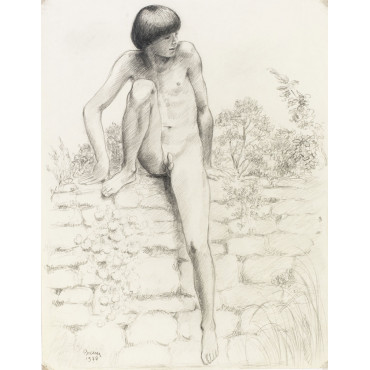 Jeune garçon assis sur un mur