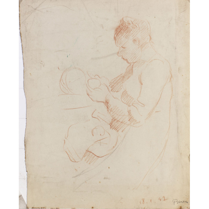 Femme assise donnant le biberon à un bébé