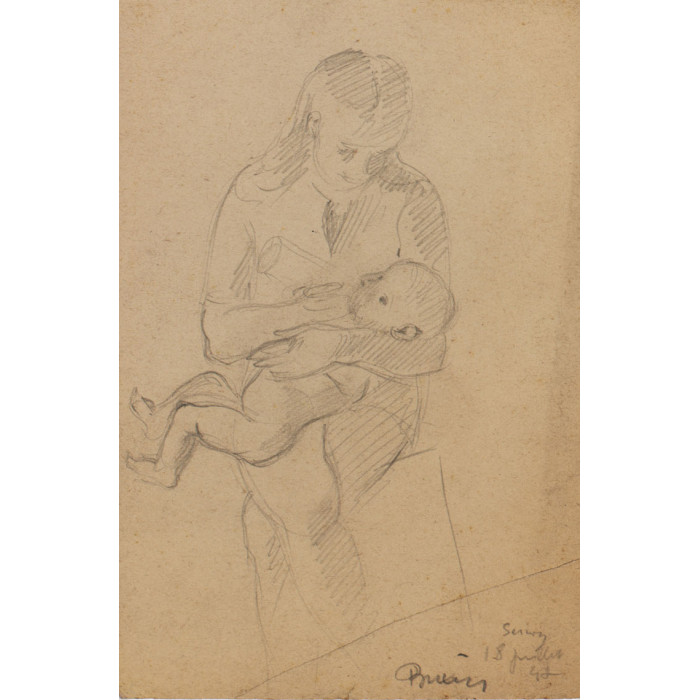 Femme assise donnant le biberon à un bébé