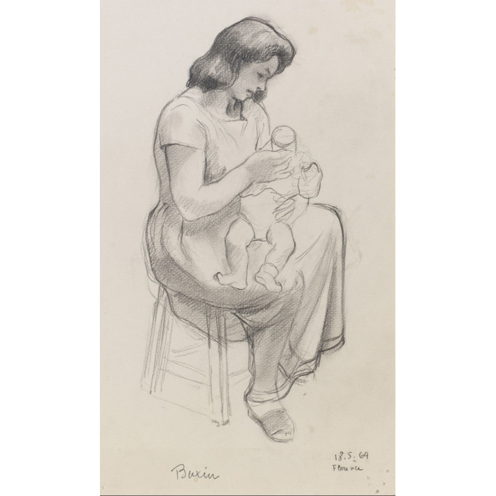 Femme habillé assis donnant le biberon