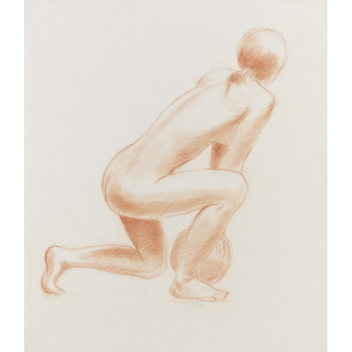 Femme accroupie tenant un ballon