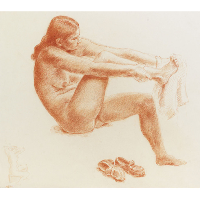 Femme nue assis de face s'essuyant le pied